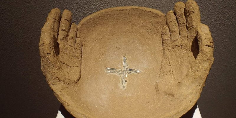 clay bowl with hands representing sanctification
